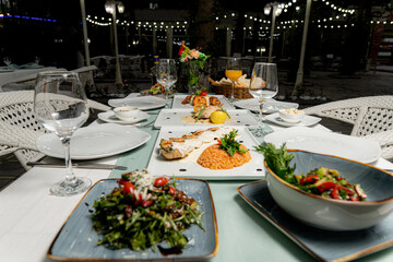 Glasses, fork, knife served for dinner in a restaurant