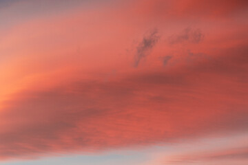 Fototapeta premium Beautiful orange and red clouds during sunset at the sea in Norway