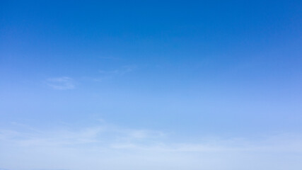 Shades of blue in the sky with some clouds.