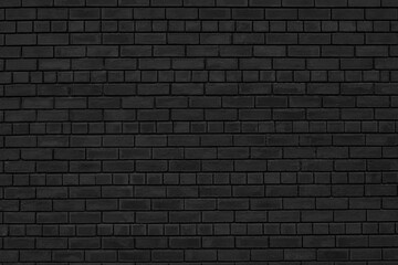 Old shabby black brick wall texture. Rough brickwork dark gloomy wallpaper. Abstract grunge textured background
