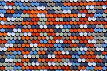 Colorful Scalloped, or “fish scale siding” adds splash of color to wall © John Nakata