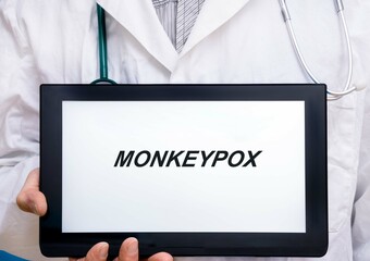 Monkeypox   virus diagnosis medical concept on tablet screen doctor with stethoscope