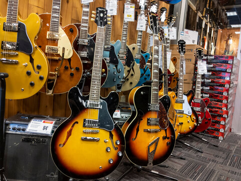 Lynnwood, WA USA - circa May 2022: View of various electric guitars for sale inside a Guitar Center musical instrument store.