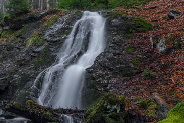 Fototapeta na wymiar Prudky rucej creek with waterfall near confluence with Jizera river