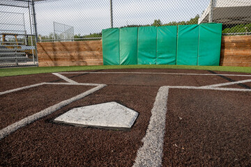 Angled view of a large, empty baseball field on a bright, sunny day