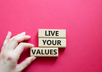 Live your values symbol. Concept words 'Live your values' on wooden blocks. Beautiful red...