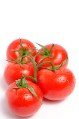 Red and ripe tomatoes white background.