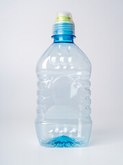 Empty plastic bottle with a sports cap