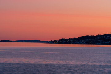 Sunset over the Oslofjord in the small town of Hvitsten, between Drobak and Son