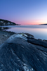 Naklejka premium Sunset over the Oslofjord in the small town of Hvitsten, between Drobak and Son