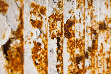Fototapeta premium Rusty bridge railing texture background with cracked white paint