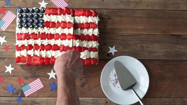 Cutting cake in the colors of the US flag. Independence Day celebration.