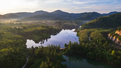 Naklejka premium The top view of nature damp with a beautiful mist on the morning of Southern of Thailand