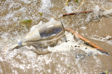 Garbage thrown out by waves beach, pollution of environment of human activity.