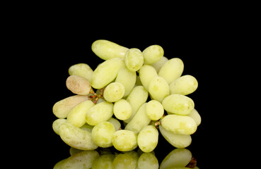 One bunch of white seedless grapes, close-up, isolated on a black background.