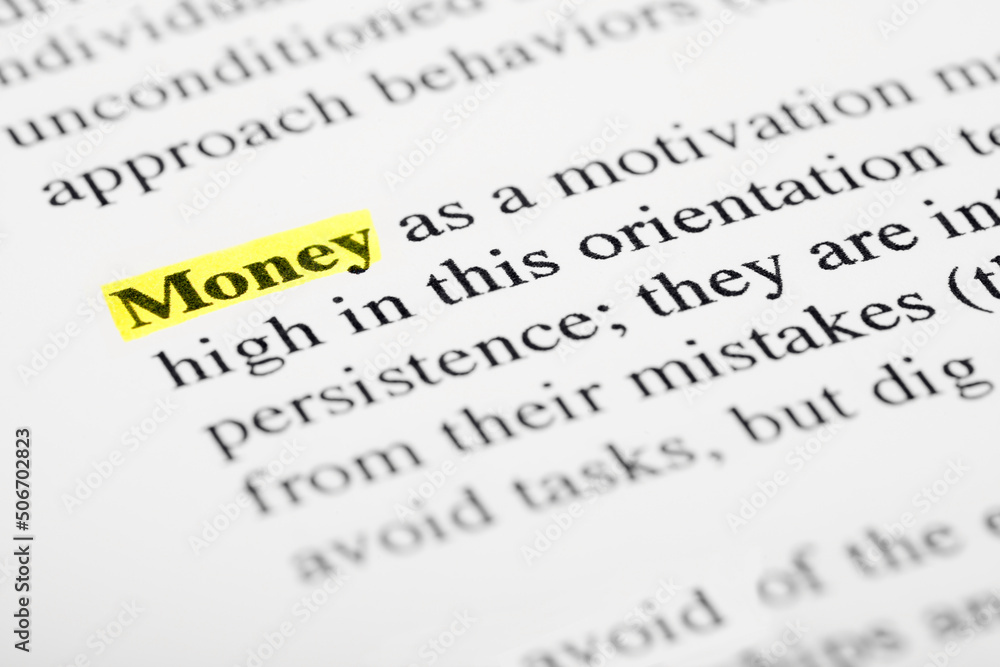 Fototapete money text macro shot highlighted in yellow color on printed paper