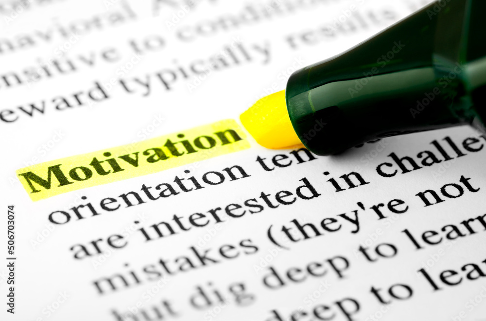 Fototapete motivation text macro shot highlighted with a highlighter in yellow color on printed paper