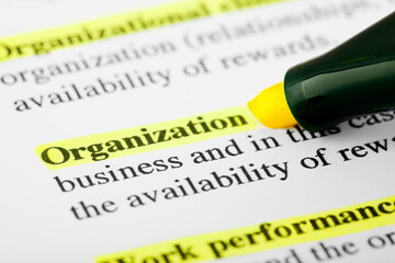 Organization Text Macro Shot Highlighted with a Highlighter in Yellow Color On Printed Paper