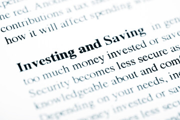 Investing and Saving Text Macro Shot On Printed Paper