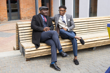 communication on the bench of two African friends