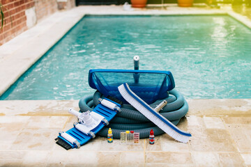 Image of pool cleaning and maintenance kit, vacuum cleaner, ph test, leaf picker and pool sweeper,...