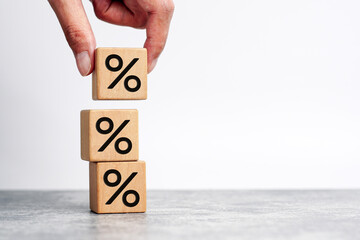 Hand picked Percent sign on wooden cubes against with copy space. Concept of sale and discount. 