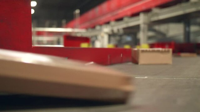 Close Shot of Postal Packages moving on belt at Postal Transfer Facility
