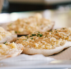 Freshly baked garlic bread in a restaurant. Detail plan