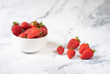 Fresh organic strawberries on ceramic table