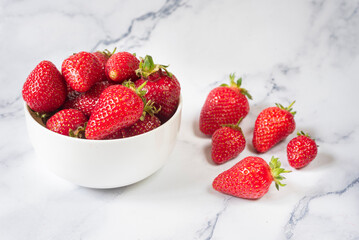 Fresh organic strawberries on ceramic table