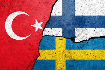 Turkish, Finland and Sweden flags painted on the concrete wall