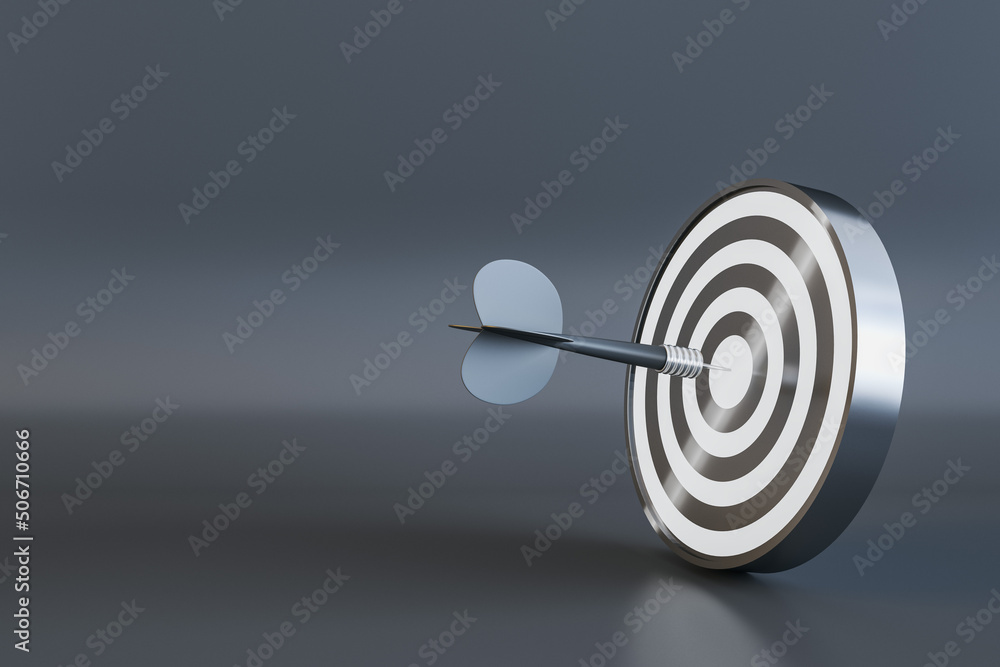 Poster dark dart hitting center of black and white target dartboard on dark background with copyspace for y
