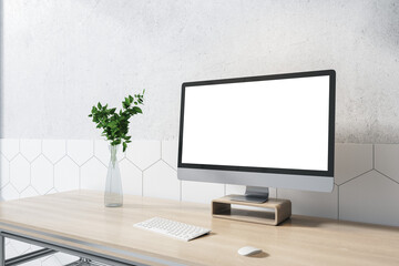 Side view on blank white monitor with copyspace for your text on wooden table with glass vase and keyboard, home office concept. 3D rendering, mock up