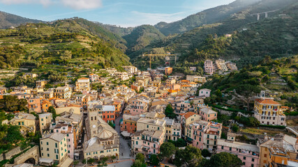 Fototapeta na wymiar Aerial view of Monterosso and landscape of Cinque Terre,Italy.UNESCO Heritage Site.Picturesque colorful coastal village located on hills.Summer holiday,travel background.Italian Riviera.