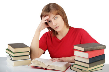 portrait of beautiful student girl sitting among the books