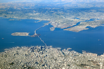 Aerial View of San Francisco looking east over the bay towards Oakland, Berkeley and Alameda Island.