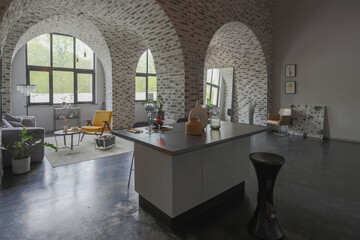 modern luxury design of a brutal apartment interior with arches in the style of a medieval castle with bright accents. free layout, kitchen area, seating and eating area.