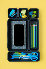 Stylish  school stationery is arranged in organizers. Creative Drawer Organizing. Storage office supplies. Concept back to school.