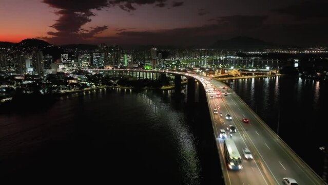 Night scape at famous third bridge at city of Vitória state of Espírito Santo Brazil. Corporate buildings at city. Night landscape of travel destination at town of Vitória Espírito Santo Brazil. 