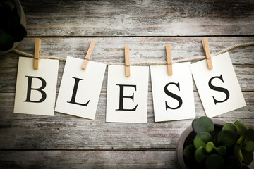 The Word BLESS Concept Printed on Cards