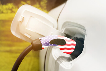 Charging an electric vehicle with an electric cable with a picture of the US flag