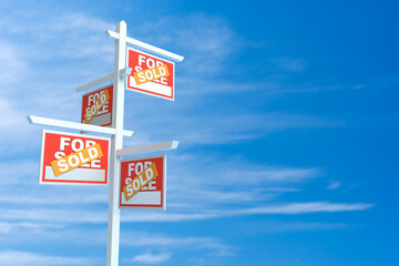 For Sale Real Estate Signs over Clouds and Blue Sky with Sun Rays. 3d Rendering