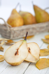 Naklejka na ściany i meble Ripe pears with leaves. food photography