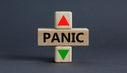Stop panic symbol. A wooden cubes with up icon. Wooden cubes with the concept word Panic. Beautiful grey table grey background. Business and stop panic concept. Copy space.