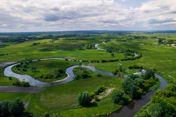 Spring Landscape in Ponidzie, Poland. Nida River. Drone View - obrazy, fototapety, plakaty