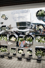 Flowers at the outdoor wedding ceremony in the mirror wall