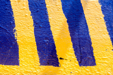 Old and Dirty Blue Yellow Striped Concrete Wall
