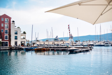 Fototapeta premium Montenegro. Tivat. Gorgeous beautiful places near the sea, palm trees, boats, restaurants and rest by the water.