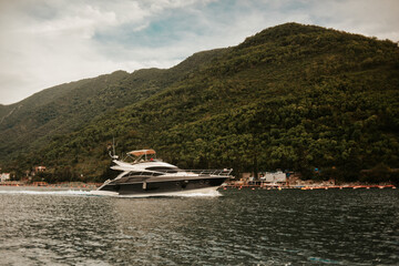 Fototapeta na wymiar Montenegro. Tivat. The yacht floats in the mountains in the sea