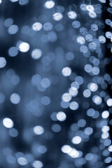 White Bokeh Lights on Dark Blue City Background